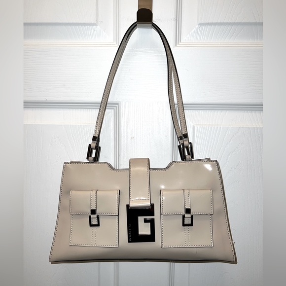 Guess Handbags - Gorgeous Guess cream colored purse with large G logo mirrored buckle. NWOT.